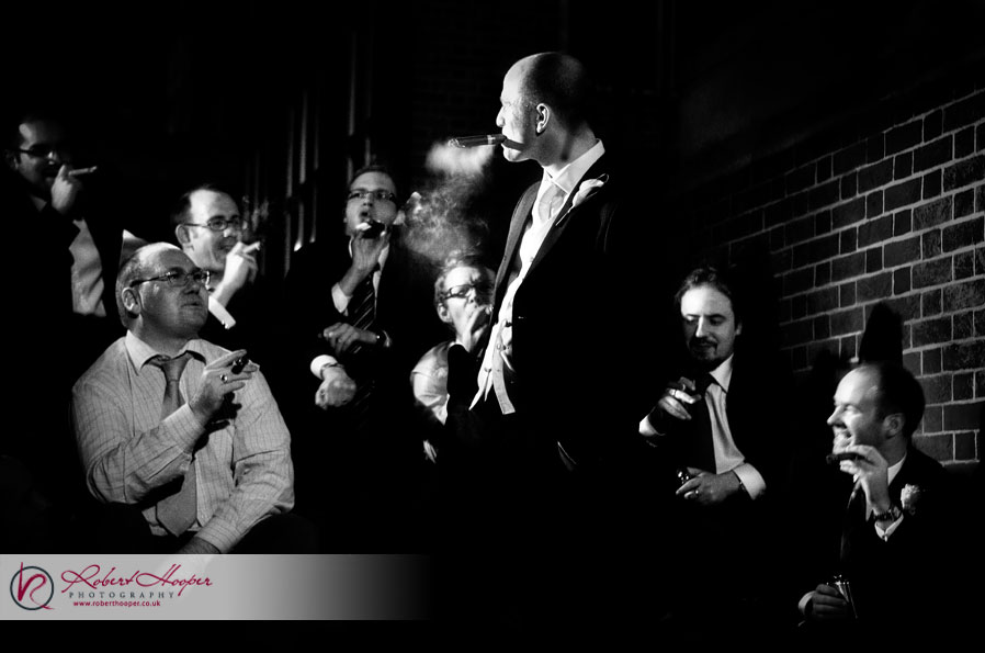 Groomsmen-smoking-cigars-at-wedding-reception