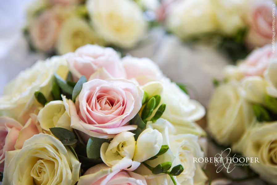 South Lodge wedding photography Bride's bouquet of pink and cream roses for wedding day at South Lodge Hotel, Horsham, West Sussex