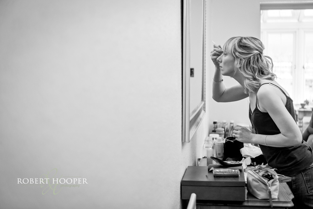 Dorking-wedding-photography Bridesmaid getting ready for wedding day at Denbies