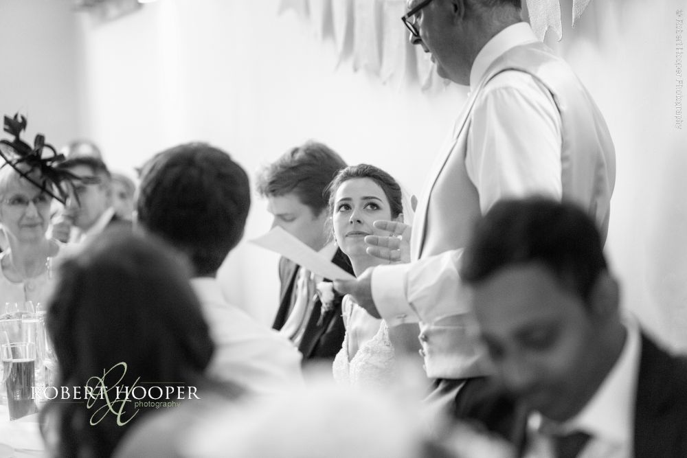 Millbridge court wedding speeches Daughter looks at dad during father of the bride speech on wedding day at Millbridge Court