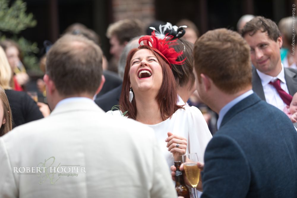 Denbies Wine Estate Wedding Photographer Surrey (17) Wedding guest laughing