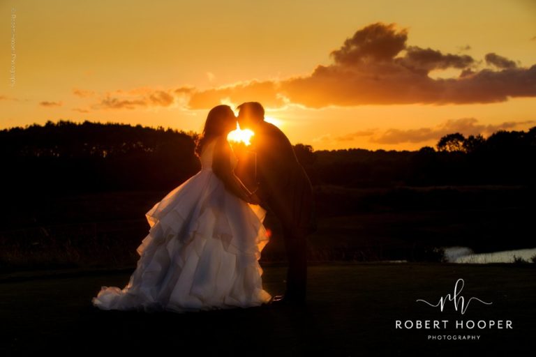 bride and groom at sunset