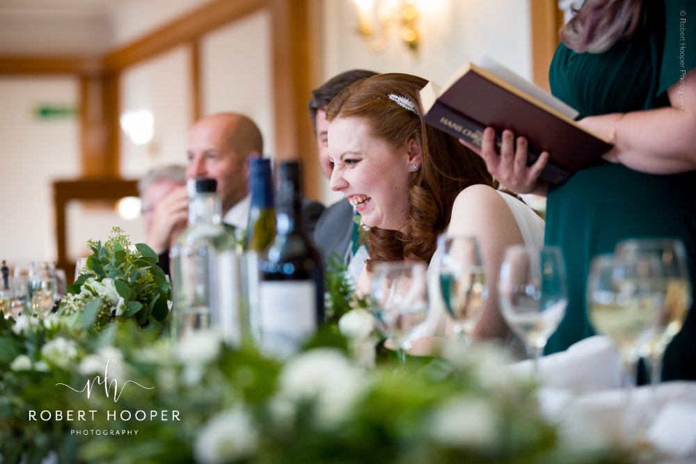 bride laughing at wedding